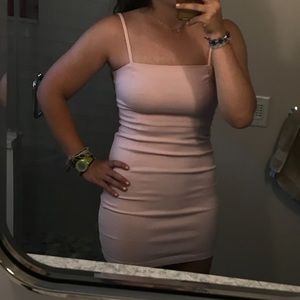 Light pink mini dress with adjustable straps and zip back